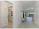 Hallway with light flooring, leading to rooms and patio at 3270 Bay Ridge Way, Port Charlotte, FL 33953