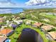 Aerial close-up view of a single Gathering home on a waterfront lot at 3270 Bay Ridge Way, Port Charlotte, FL 33953