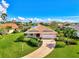 Single-Gathering home with a paved driveway and landscaping at 3270 Bay Ridge Way, Port Charlotte, FL 33953
