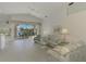 Spacious living room with view to a patio and pool at 3270 Bay Ridge Way, Port Charlotte, FL 33953