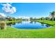 Scenic view of a serene lake in a peaceful community at 3270 Bay Ridge Way, Port Charlotte, FL 33953