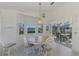 Light-filled dining room with wood table and chairs, plus view to the backyard at 3270 Bay Ridge Way, Port Charlotte, FL 33953