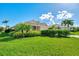 Single-Gathering home with manicured lawn and tropical landscaping at 3270 Bay Ridge Way, Port Charlotte, FL 33953