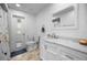 Bathroom with white vanity, marble countertop, and tiled floors at 34 Golfview Ct, Rotonda West, FL 33947