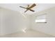 Simple bedroom with ceiling fan and neutral wall colors at 40 Mark Twain Ln, Rotonda West, FL 33947