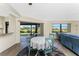 Dining area with view of the backyard and kitchen at 40 Mark Twain Ln, Rotonda West, FL 33947