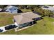 Aerial view of single-story home with a pool and driveway at 640 Curtis Blvd, Englewood, FL 34223