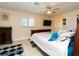 Spacious bedroom with a comfortable sleigh bed and ceiling fan at 640 Curtis Blvd, Englewood, FL 34223