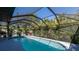 Large, screened-in swimming pool in backyard at 640 Curtis Blvd, Englewood, FL 34223