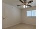 Well-lit bedroom with ceiling fan and tile floor at 6800 Placida Rd # 169, Englewood, FL 34224