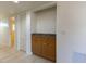 Hallway with built-in wood cabinet and granite top at 6800 Placida Rd # 169, Englewood, FL 34224