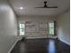 Spacious bedroom with wood-look floors and a large window at 705 Chevy Chase Nw St, Port Charlotte, FL 33948