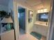 Clean bathroom with vanity, shower/tub combo and mirror at 9 Annapolis Ln, Rotonda West, FL 33947