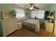 Bedroom with a double bed, white dresser, and light green walls at 9 Annapolis Ln, Rotonda West, FL 33947