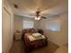 Bright bedroom with double bed and two windows at 9 Annapolis Ln, Rotonda West, FL 33947