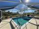 Inviting screened pool area with patio furniture at 9 Annapolis Ln, Rotonda West, FL 33947