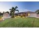 Backyard with shed and landscape lighting at dusk at 9431 Prospect Ave, Englewood, FL 34224