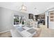 Bright dining area with white table and kitchen view at 9431 Prospect Ave, Englewood, FL 34224