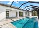 Covered patio overlooking a refreshing pool with a view of the canal at 10107 Boylston St, Port Charlotte, FL 33981