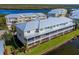 Back view of townhome showing private patio and waterfront location at 10325 Longshore Rd # 17, Placida, FL 33946