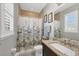 Well-lit bathroom with shower/tub combo and granite vanity at 10325 Longshore Rd # 17, Placida, FL 33946