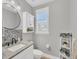 Modern bathroom with granite vanity and updated fixtures at 10325 Longshore Rd # 17, Placida, FL 33946