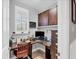 Bright home office with built-in shelving and a corner desk at 10325 Longshore Rd # 17, Placida, FL 33946