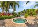 Community hot tub surrounded by tropical landscaping at 10325 Longshore Rd # 17, Placida, FL 33946
