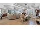 Spacious living room with a large sectional sofa and access to a balcony at 10325 Longshore Rd # 17, Placida, FL 33946