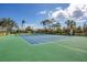 Well-maintained tennis court with green surface at 10325 Longshore Rd # 17, Placida, FL 33946