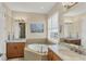 Spa-like bathroom with a large soaking tub and double vanity at 10325 Longshore Rd # 20, Placida, FL 33946