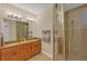 Guest bathroom with double vanity and walk-in shower at 10325 Longshore Rd # 20, Placida, FL 33946