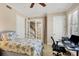 Bedroom with twin bed, workspace, and access to a staircase at 10325 Longshore Rd # 20, Placida, FL 33946