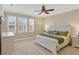 Second bedroom with king-size bed and ceiling fan at 10325 Longshore Rd # 20, Placida, FL 33946