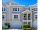 Townhouse exterior featuring a two-story design and attached garage at 10325 Longshore Rd # 20, Placida, FL 33946