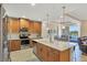 Modern kitchen with stainless steel appliances and island at 10325 Longshore Rd # 20, Placida, FL 33946