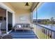 Spacious screened porch with lake view and seating area at 10325 Longshore Rd # 20, Placida, FL 33946