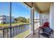 Screened porch with seating and lake view at 10325 Longshore Rd # 20, Placida, FL 33946