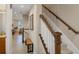 Elegant staircase with wooden handrail and bench at 10325 Longshore Rd # 20, Placida, FL 33946
