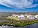 Aerial view of condo community near the water at 10521 Amberjack Way # 102, Englewood, FL 34224