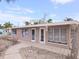 Ranch-style home with a flat roof and light brown exterior at 1205 Gulf Blvd, Englewood, FL 34223