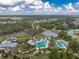 Community pool and recreation area with surrounding landscape at 12753 Sagewood Dr, Venice, FL 34293