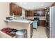 Modern kitchen featuring ample cabinetry and a breakfast bar at 12753 Sagewood Dr, Venice, FL 34293