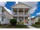 Two-story Craftsman style home with front porch and balcony at 12753 Sagewood Dr, Venice, FL 34293