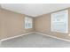 Simple bedroom with neutral walls and carpet flooring at 12753 Sagewood Dr, Venice, FL 34293