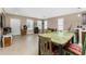 Open living area with tile floors and a view to the kitchen at 12753 Sagewood Dr, Venice, FL 34293