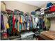 Large walk-in closet with ample hanging space and shelving at 12753 Sagewood Dr, Venice, FL 34293