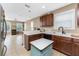 Open kitchen with a breakfast bar and stainless steel appliances at 12753 Sagewood Dr, Venice, FL 34293