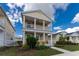 Two-story house with a front porch and a well-maintained yard at 12753 Sagewood Dr, Venice, FL 34293