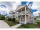 Two-story house with a front porch, and a well-maintained yard at 12753 Sagewood Dr, Venice, FL 34293